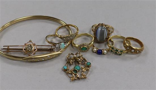 Four 18ct gold and gem set rings, three 9ct and gem set, a 9ct gold pendant, a yellow metal bar brooch and a diamond set bangle.